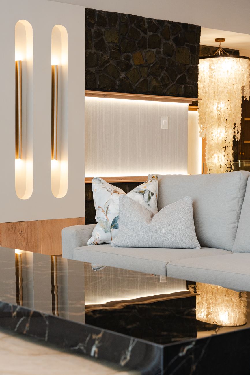 Living area with black stone detailing designed by Kirsty Badenhorst Interiors, South Africa